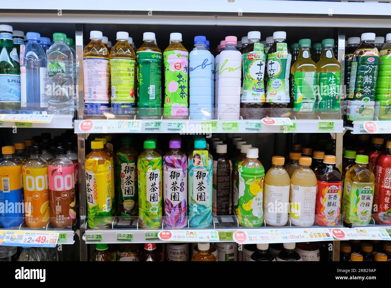 Assorted iced tea flavors, varieties and Taiwanese and Asian brands on display on a refrigerated rack at a Family Mart; bottled cold drinks, ice tea. Stock Photo