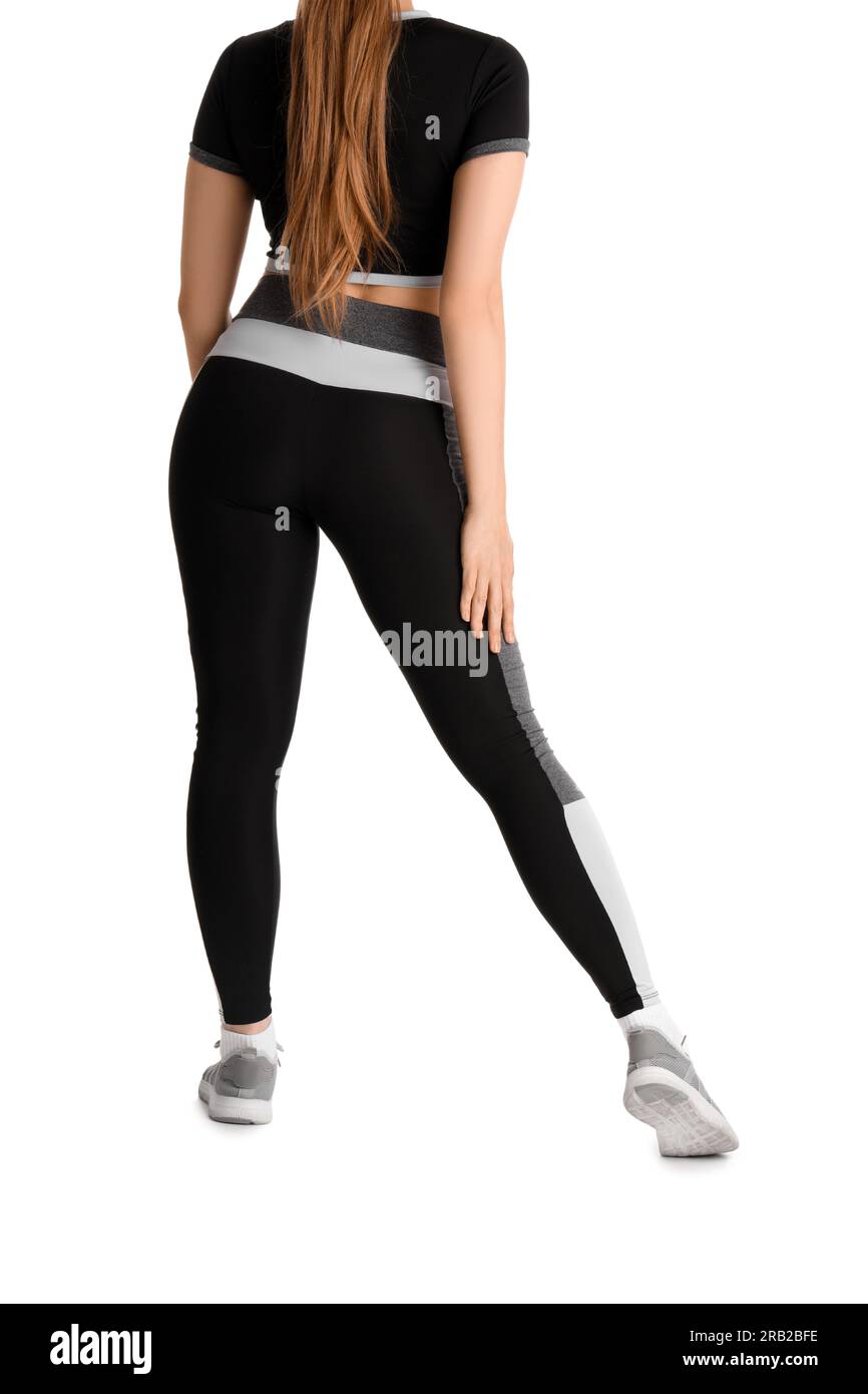Young woman in sportswear on white background, back view Stock Photo ...