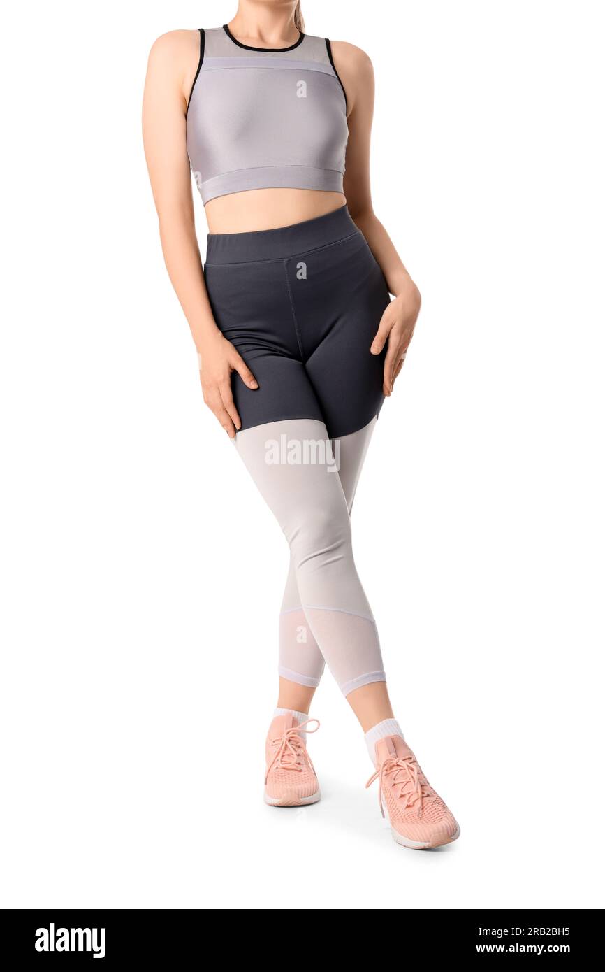 Young woman in sportswear on white background Stock Photo - Alamy