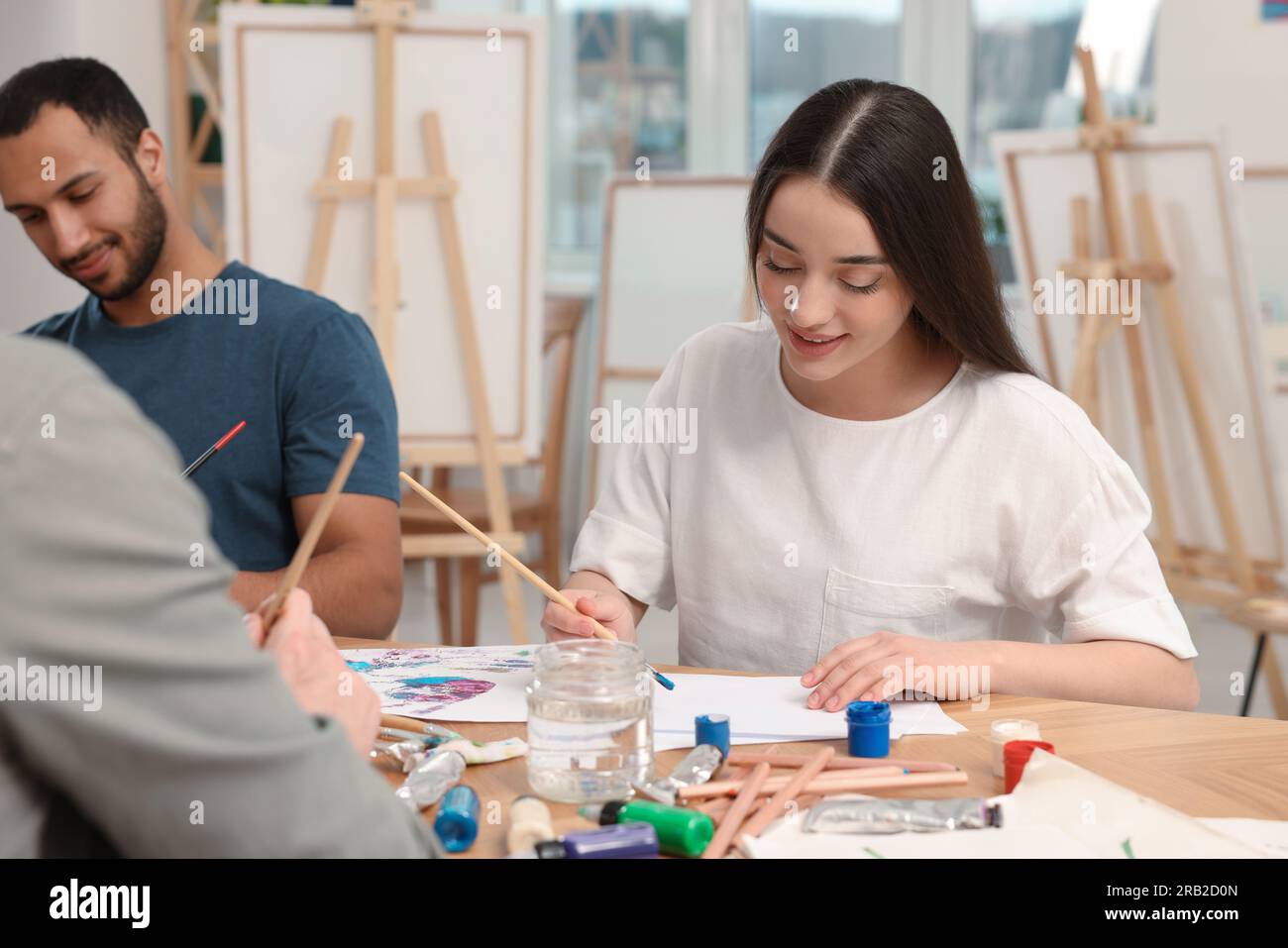 Group of students attending painting class in studio. Creative hobby Stock Photo