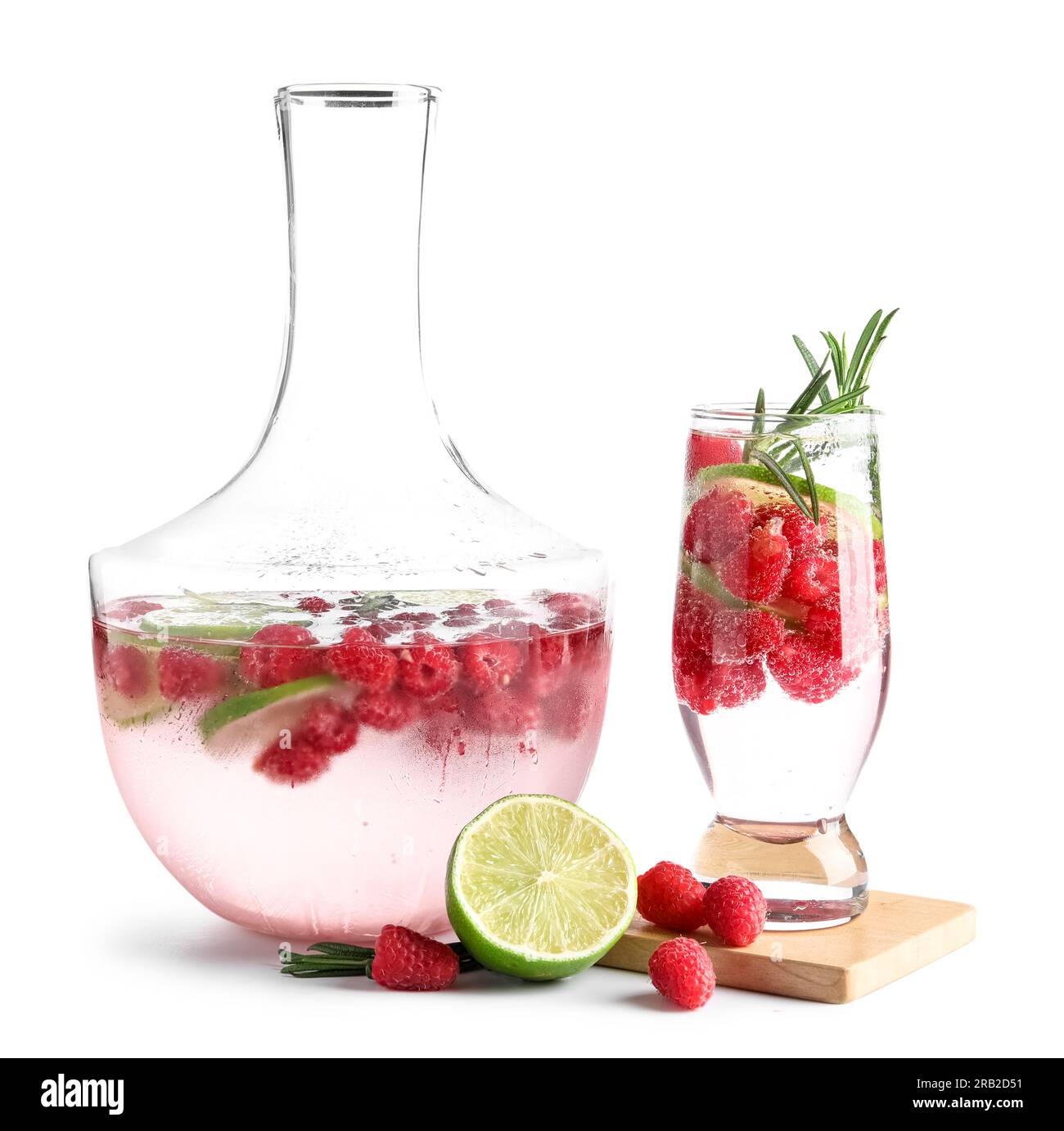 Glass and bottle of fresh raspberry lemonade with rosemary on white ...