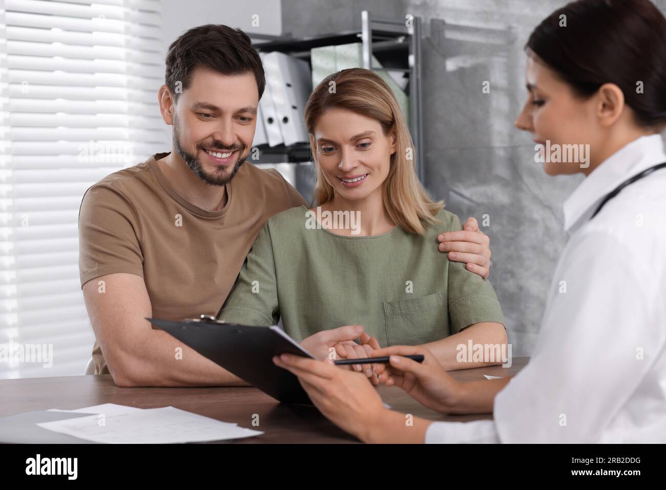Couple having appointment with fertility doctor in clinic. Patient