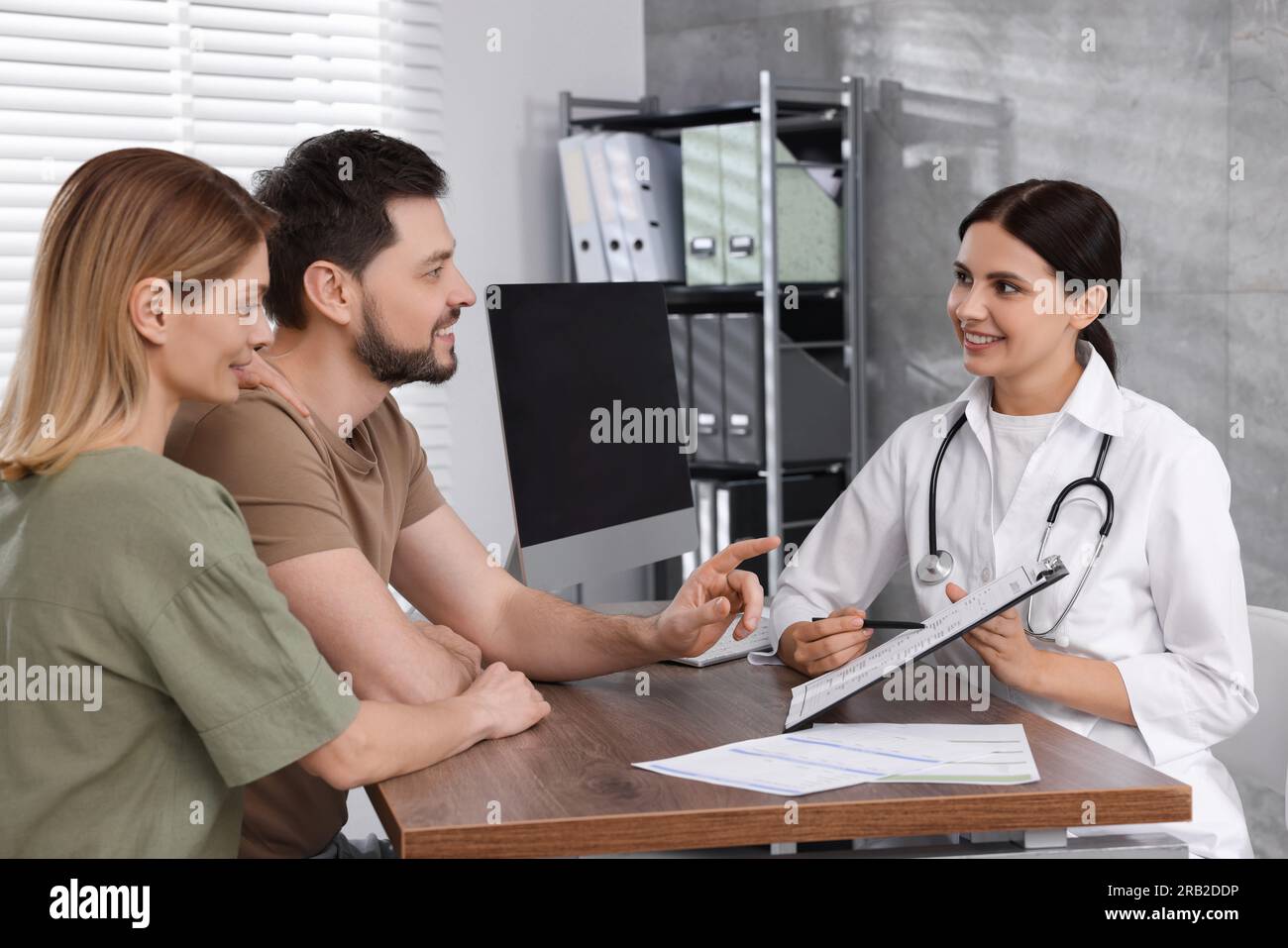 Couple having appointment with fertility doctor in clinic. Patient