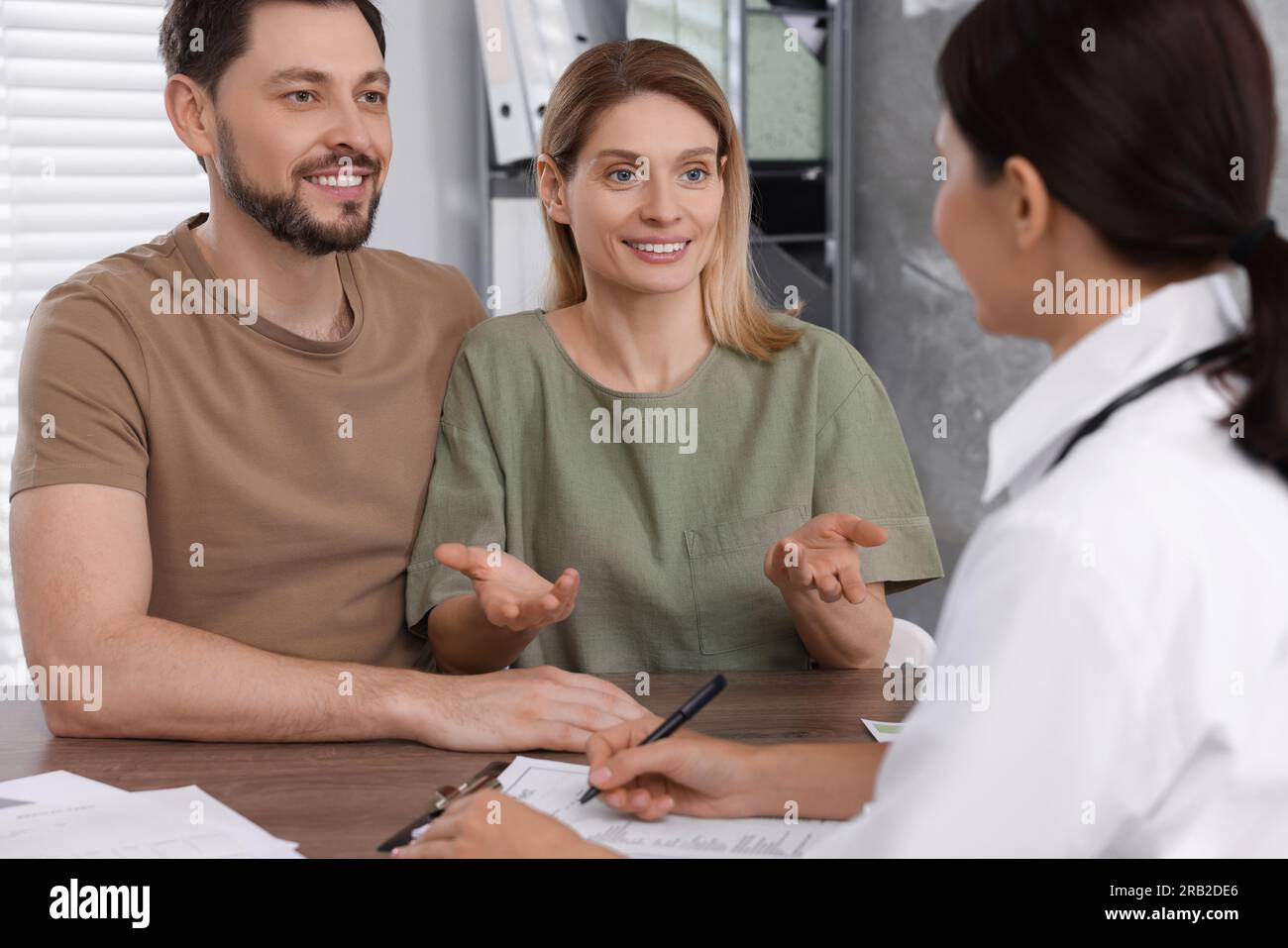 Couple having appointment with fertility doctor in clinic. Patient