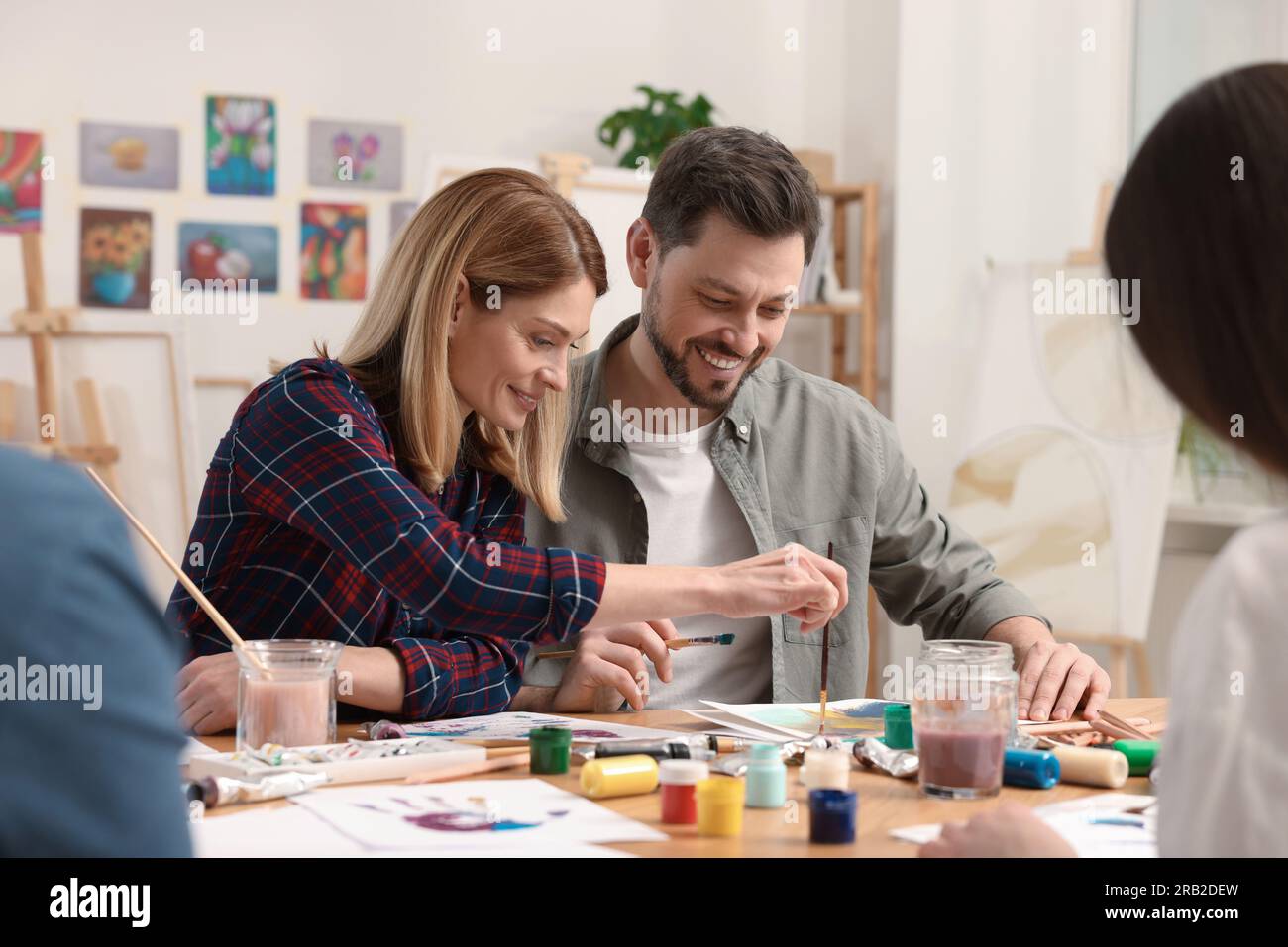 Group of students attending painting class in studio. Creative hobby Stock Photo