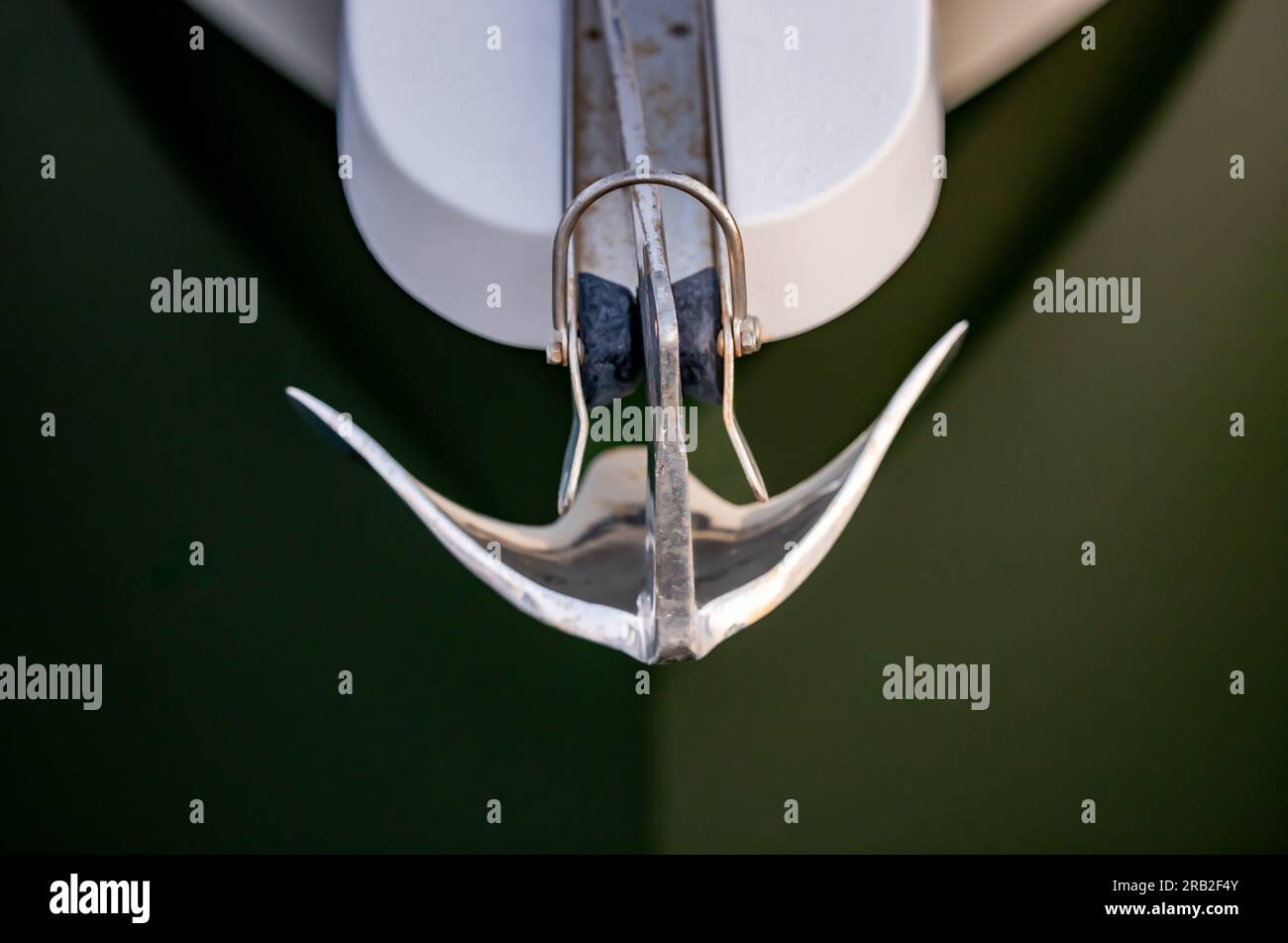 detail shot of a stainless steel anchor on a motor boat Stock Photo