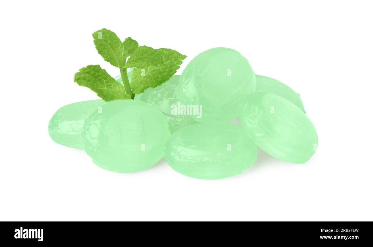 Many light green cough drops with mint on white background Stock Photo