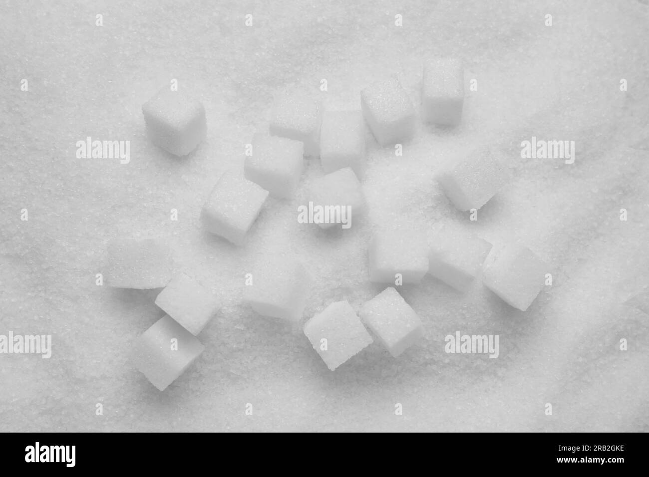 Different types of white sugar as background, closeup Stock Photo