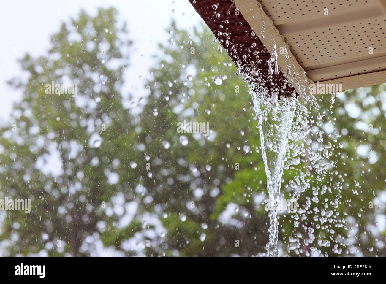 During heavy rain, water comes from over gutters Stock Photo Alamy
