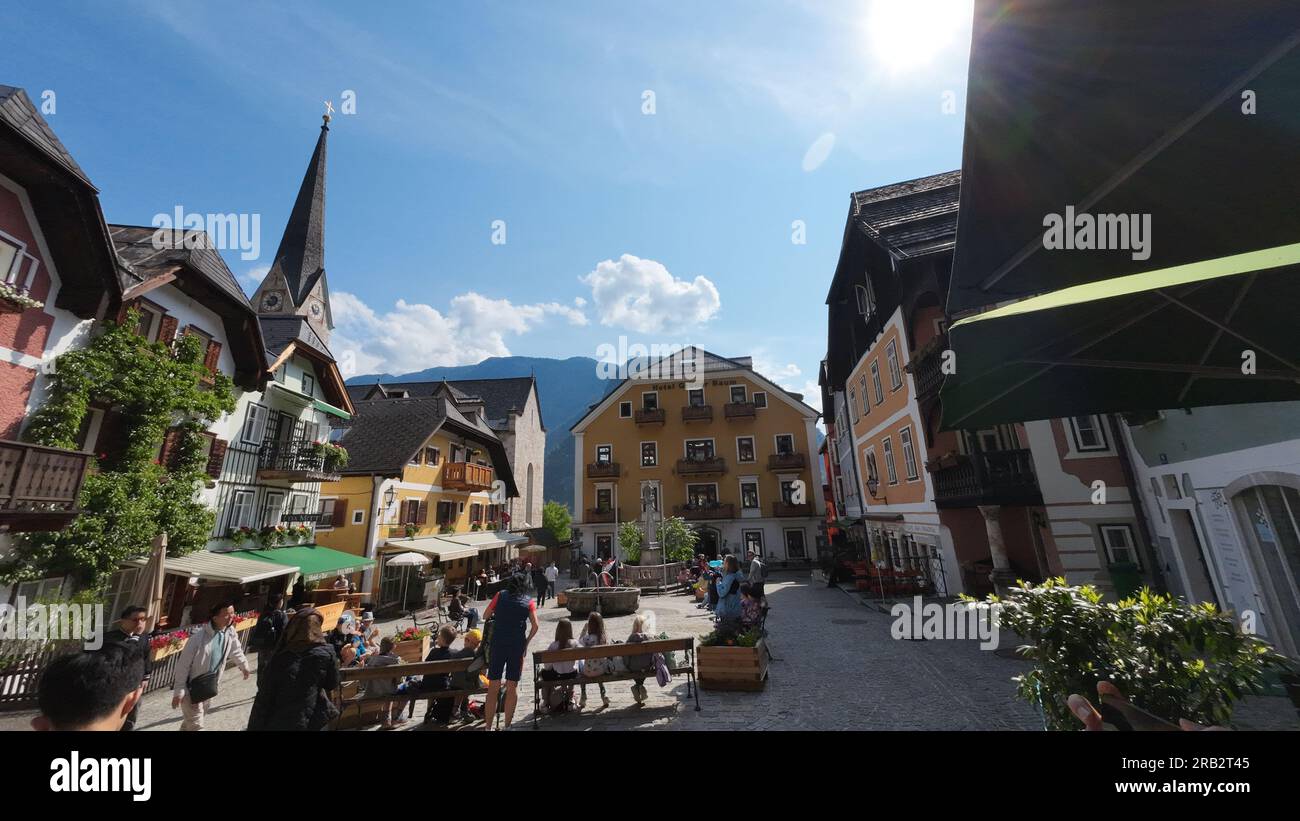 Street life in Hallstatt old town, best travel village, famous tourist attraction in Austria. HALLSTATT, AUSTRIA - JUNE 7, 2023 Stock Photo