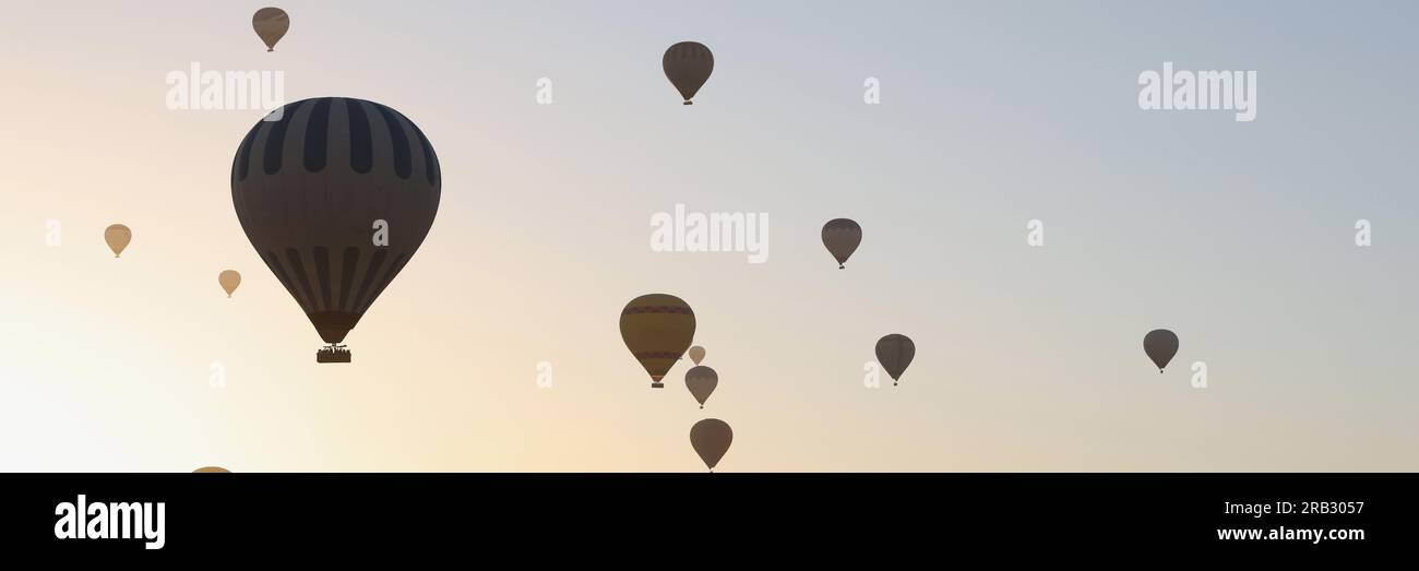 Hot air balloons in sky on sunset Stock Photo - Alamy