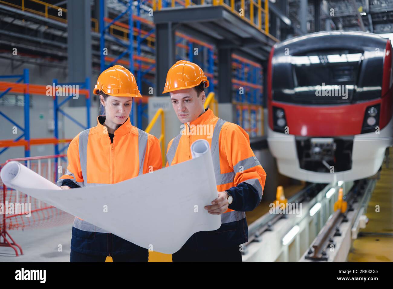 Electric train engineer mechanic staff team worker looking system plan