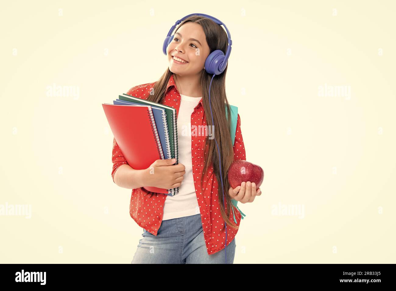 Back to school. Schoolgirl student in headphones with school bag ...