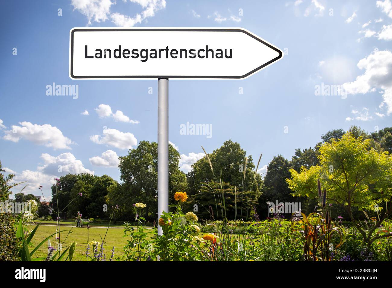Symbol image Landesgartenschau, Germany (State Horticultural Show): Directional arrow with the inscription Landesgartenschau in a park (Compsosing) Stock Photo
