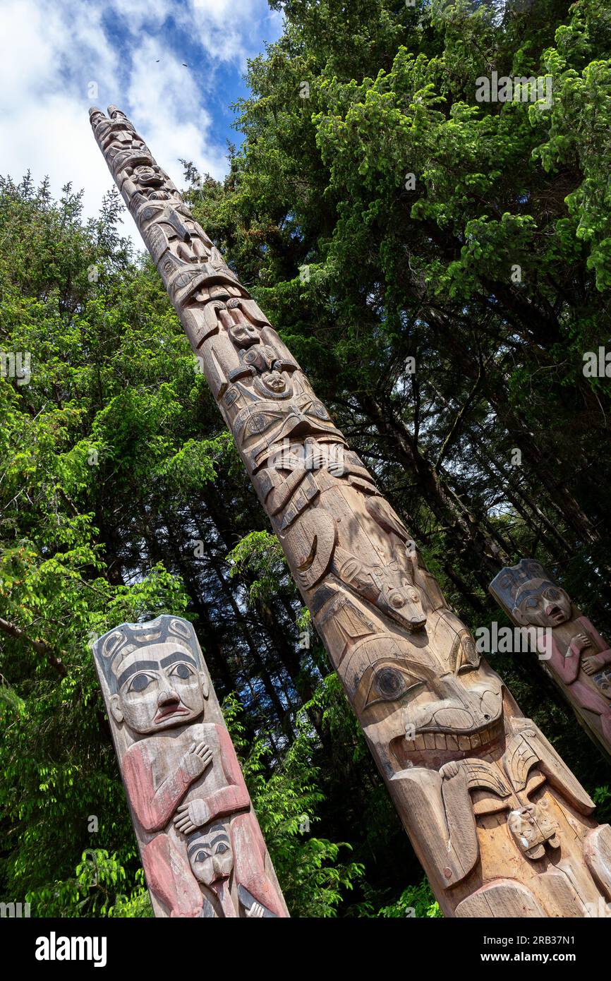 Totem Poles at a Coastal Preserve in Sitka National Historic Park in Alaska Stock Photo
