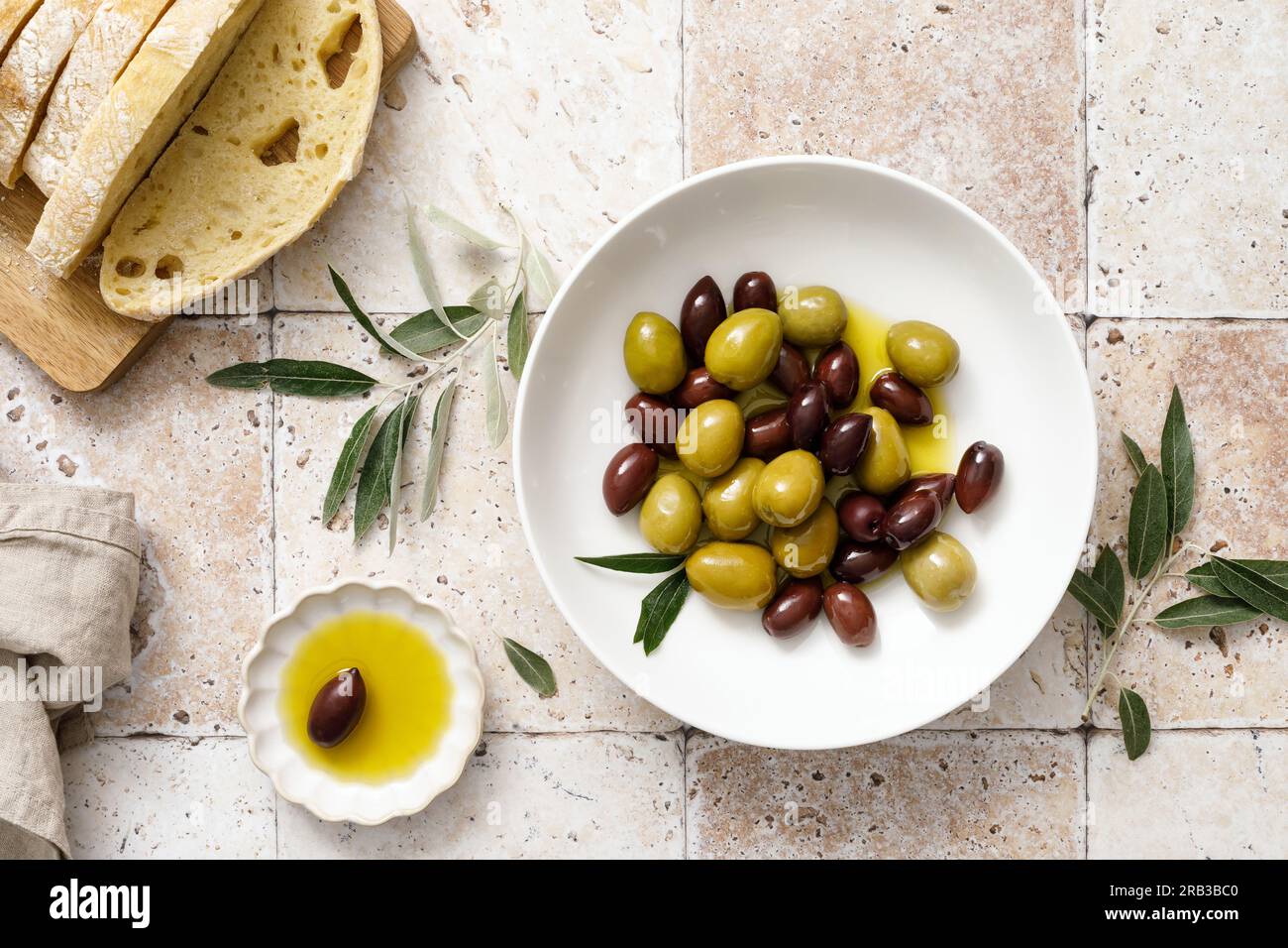 Olives, olive oil and ciabatta, top view Stock Photo