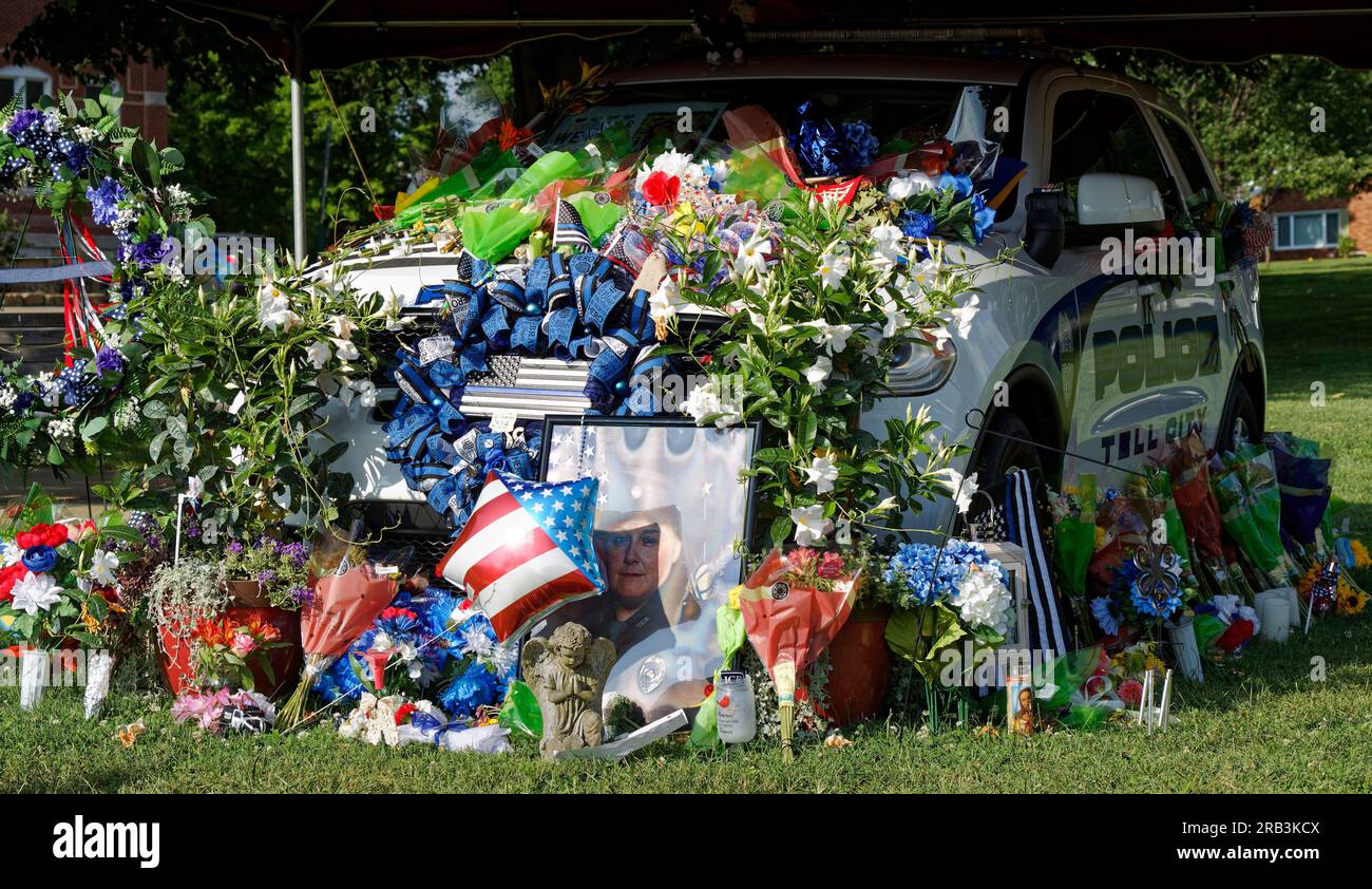 Flowers and memorial tributes are piled alongside the Dodge Durango patrol vehicle of Tell City Police Department Sgt. Heather J. Glenn on Thursday, July 6, 2023 near city hall in Tell City, Troy Township, Perry County, IN, USA. Glenn, 47, was shot and killed July 3 while trying to arrest a domestic violence suspect at a local hospital, becoming the first line-of-duty death in the Tell City Police Department's nearly 165-year history and second Indiana police officer to be killed in the line of duty in less than a week. (Apex MediaWire Photo by Billy Suratt) Stock Photo