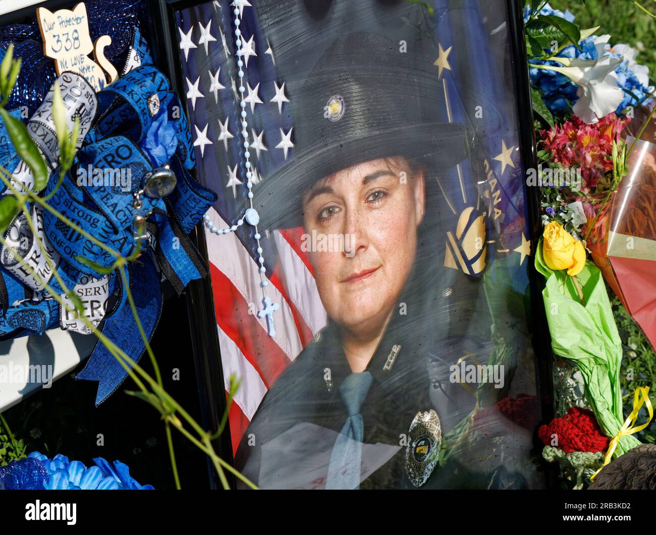 A photograph of Tell City Police Department Sgt. Heather J. Glenn leans