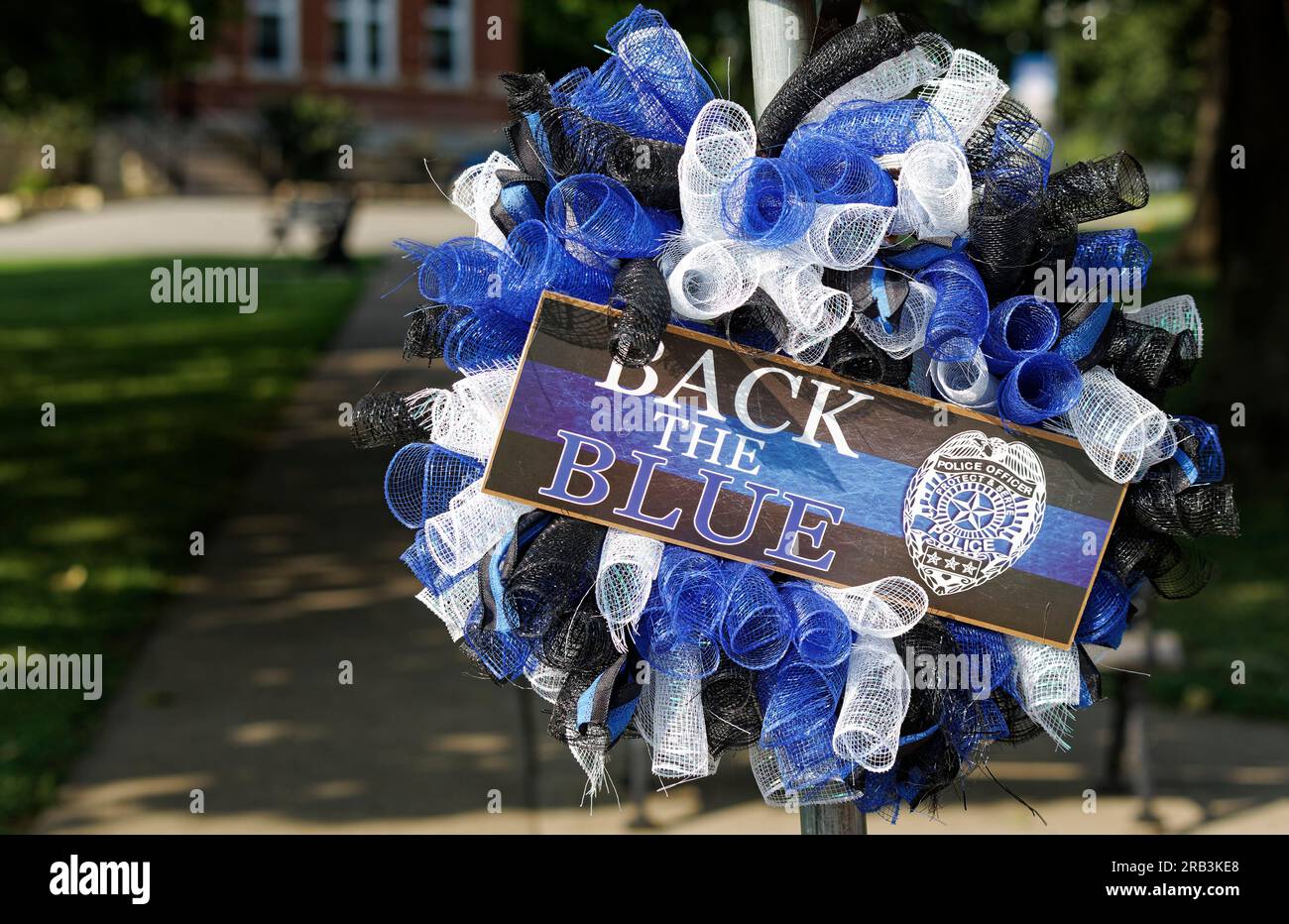 'Back the Blue' and an illustration of a police badge adorn a wreath hanging near the patrol vehicle of Tell City Police Department Sgt. Heather J. Glenn on Thursday, July 6, 2023 near city hall in Tell City, Troy Township, Perry County, IN, USA. Glenn, 47, was shot and killed July 3 while trying to arrest a domestic violence suspect at a local hospital, becoming the first line-of-duty death in the Tell City Police Department's nearly 165-year history and second Indiana police officer to be killed in the line of duty in less than a week. (Apex MediaWire Photo by Billy Suratt) Stock Photo