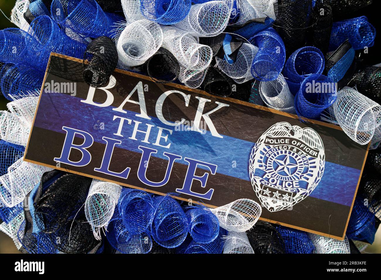 'Back the Blue' and an illustration of a police badge adorn a wreath hanging near the patrol vehicle of Tell City Police Department Sgt. Heather J. Glenn on Thursday, July 6, 2023 near city hall in Tell City, Troy Township, Perry County, IN, USA. Glenn, 47, was shot and killed July 3 while trying to arrest a domestic violence suspect at a local hospital, becoming the first line-of-duty death in the Tell City Police Department's nearly 165-year history and second Indiana police officer to be killed in the line of duty in less than a week. (Apex MediaWire Photo by Billy Suratt) Stock Photo
