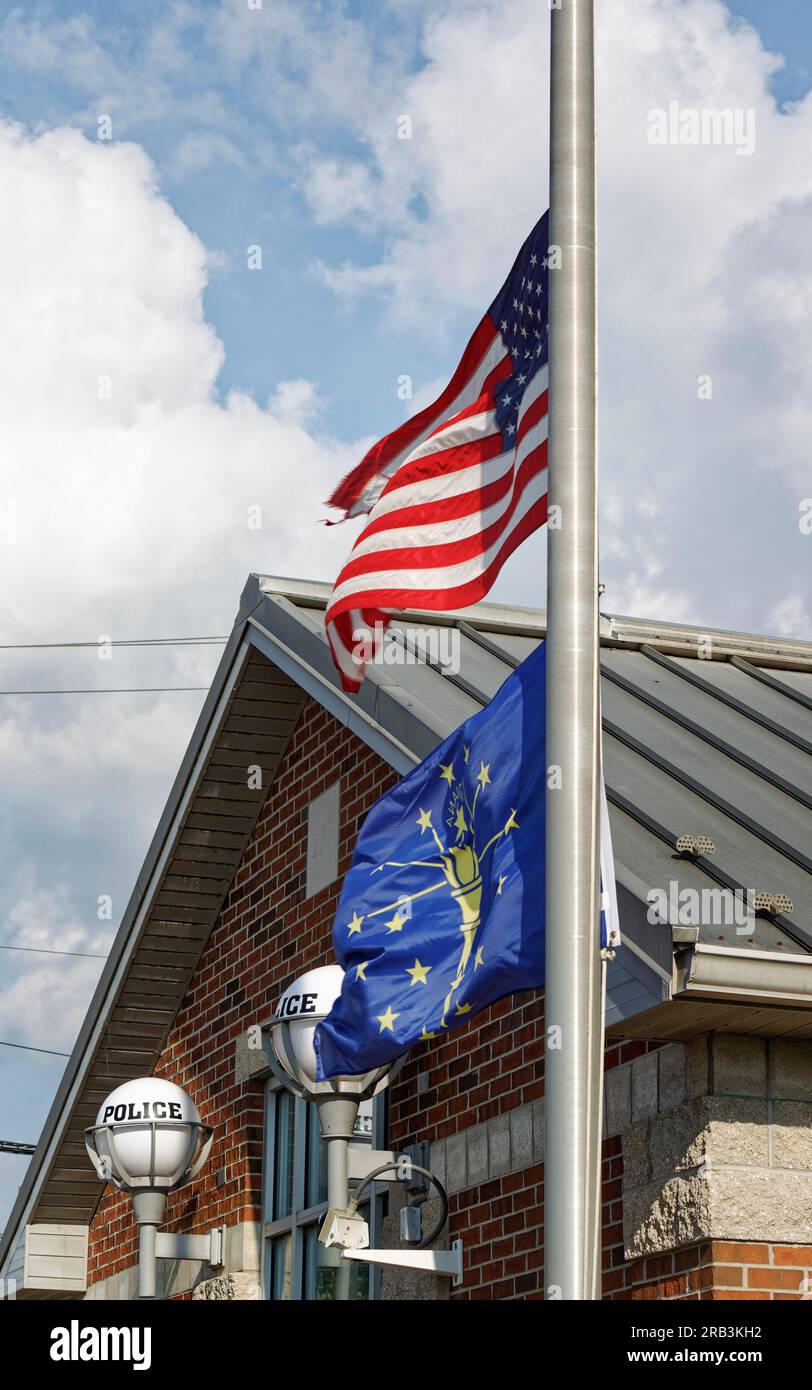 Flags fly at half-staff outside the Tell City Police Department on Thursday, July 6, 2023 in Tell City, Troy Township, Perry County, IN, USA. Tell City Police Sgt. Heather J. Glenn, 47, was shot and killed while trying to arrest a domestic violence suspect on July 3 at a local hospital, the first line-of-duty death in the Tell City Police Department's nearly 165-year history and second Indiana police officer to be killed in the line of duty in less than a week. (Apex MediaWire Photo by Billy Suratt) Stock Photo