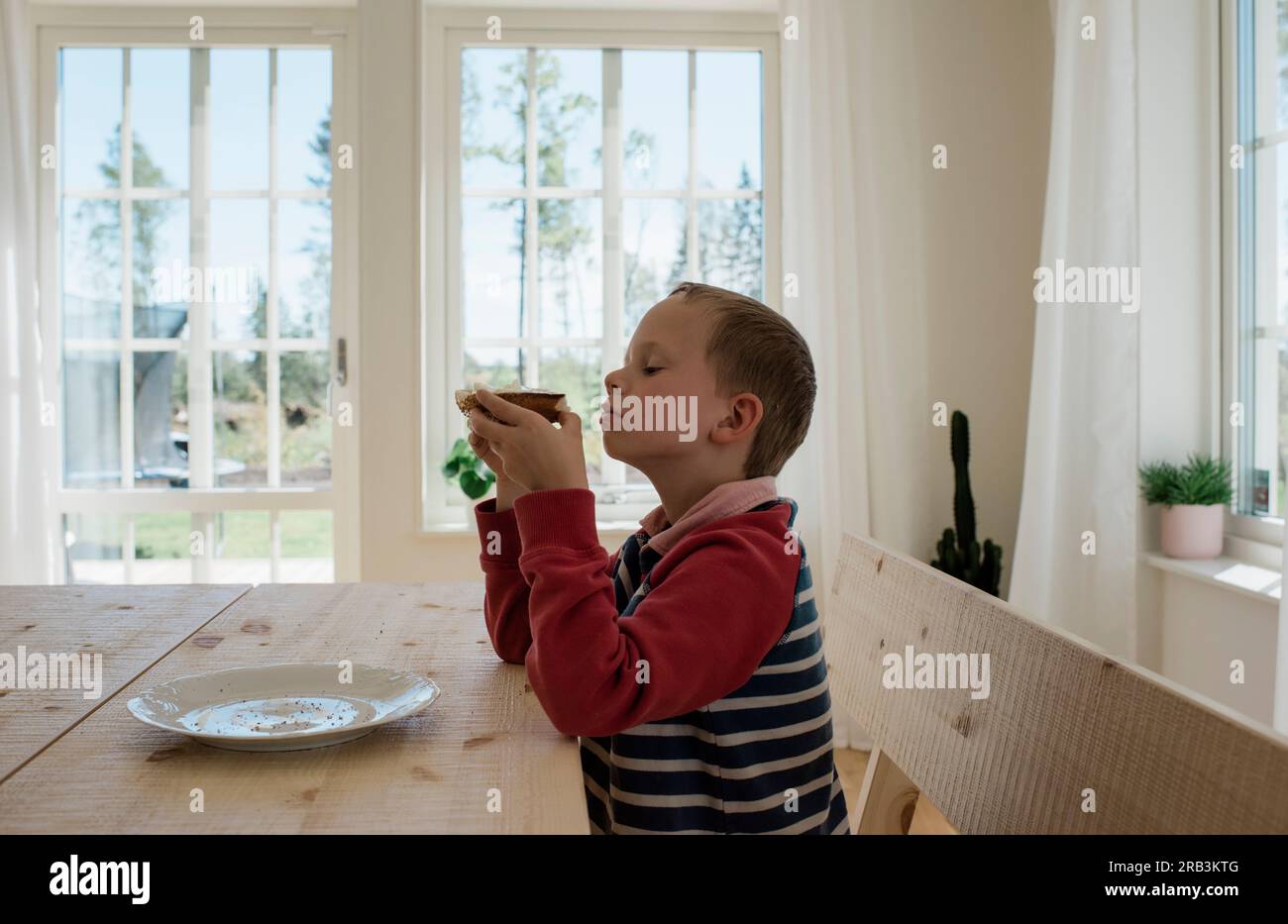 Boy thinking dinner hi-res stock photography and images - Alamy