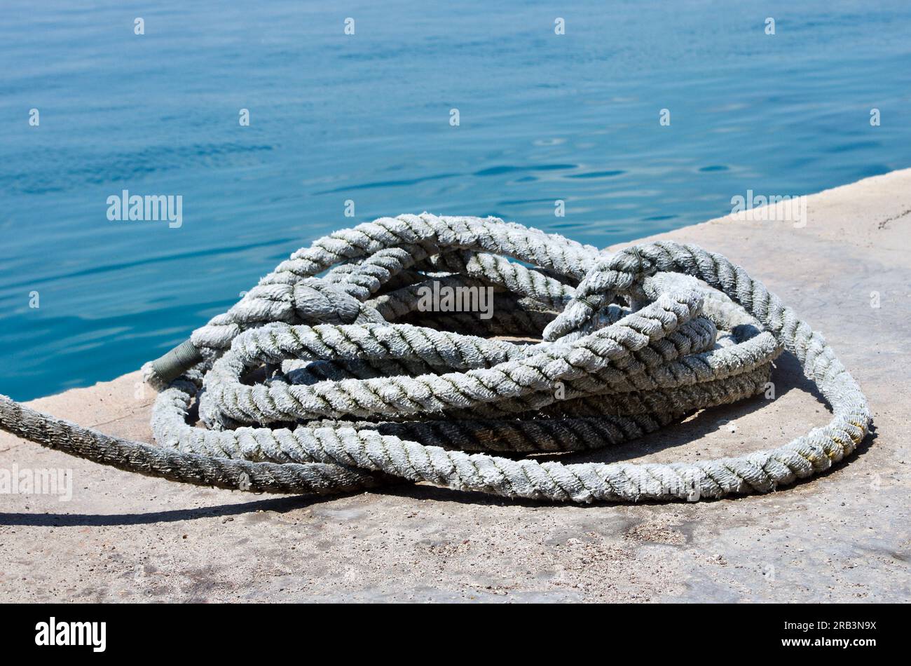 Heap of rope for mooring at a quay on the island Malta. Stock Photo