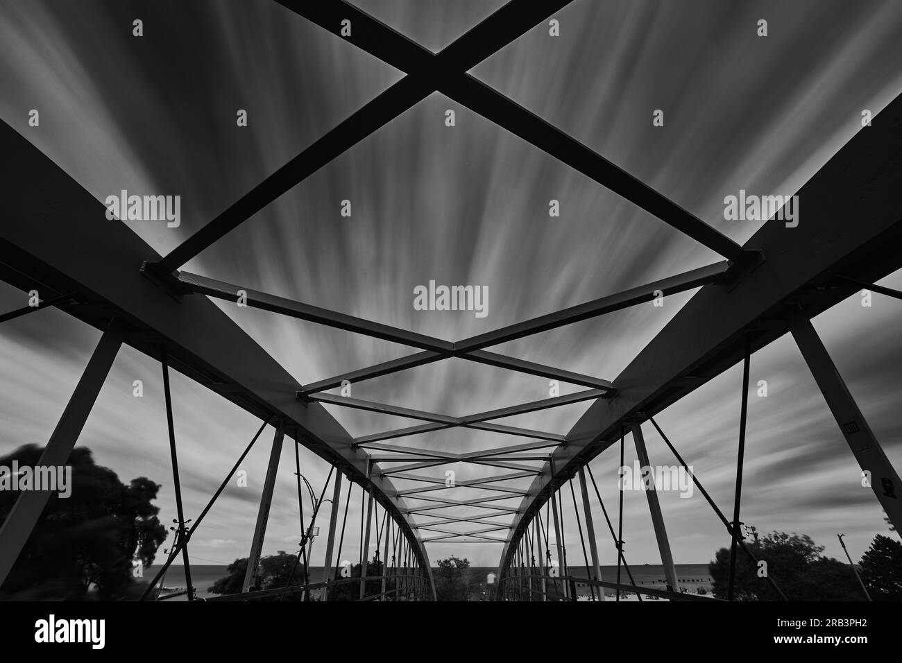 pedestrian bridge in chicago the dreamy clouds. Long exposition Stock Photo