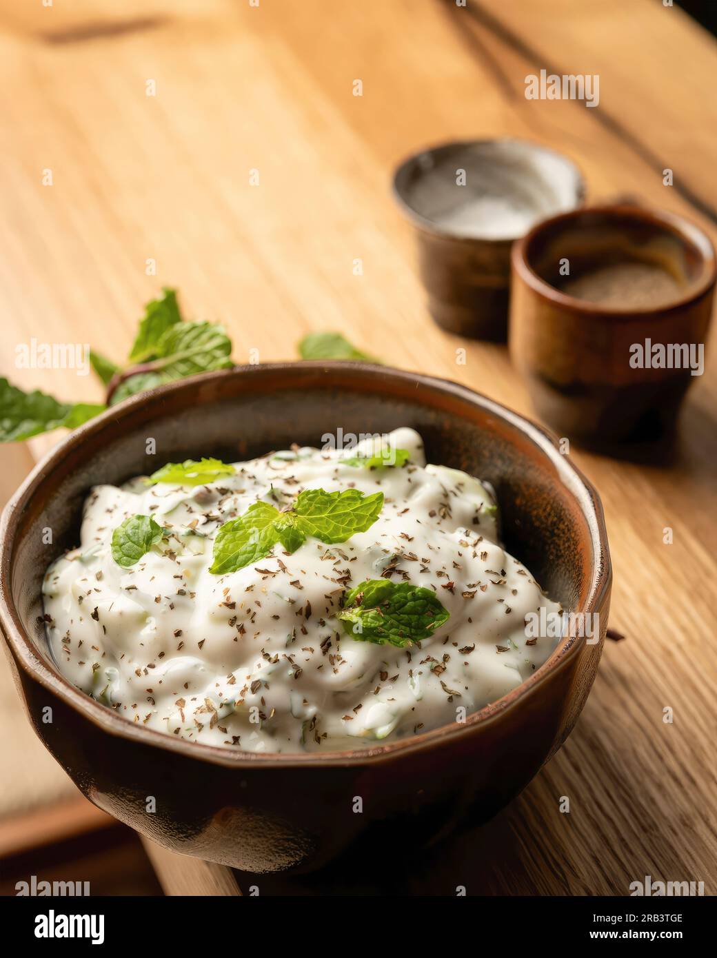 Tzatziki, also known as cacık or tarator, is a class of dip, soup, or sauce found in the cuisines of Southeastern Europe and the Middle East. Stock Photo