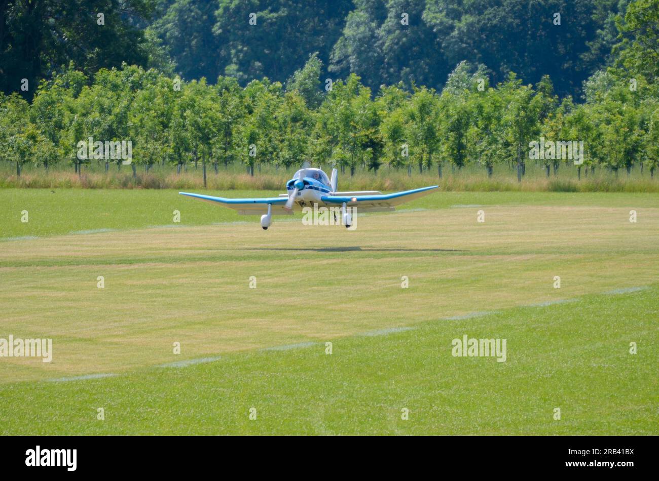 SAN Jodel D150 Mascaret plane landing on grass airstrip at a wings and
