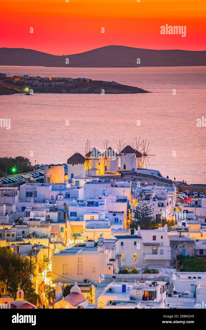 Mykonos, Greece. Sunset over Aegean Sea and the famous windmill from above, Mykonos Island, Cyclades archipelago. Stock Photo