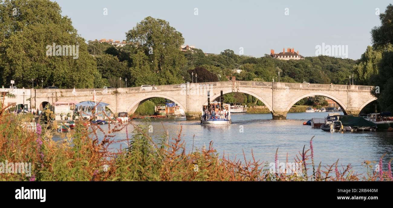 The New Southern Belle - a Mississippi style stern-wheeler paddle steamer passing under Richmond Bridge on the Thames, Richmond, London, England Stock Photo