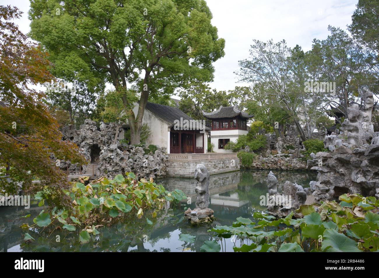 ancinet chinese house on the edge of pond in the public park in Suzhou Stock Photo