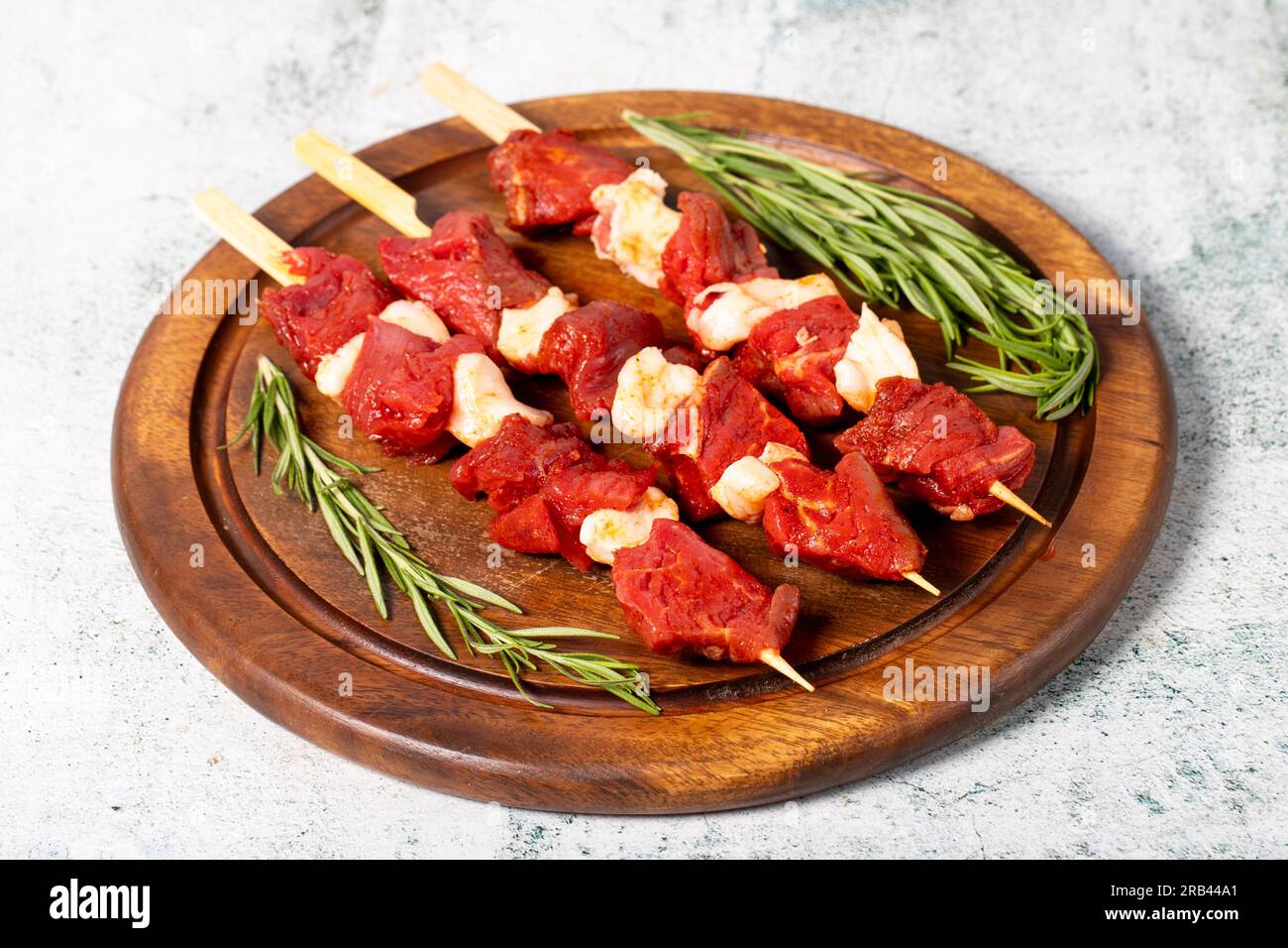 Beef cubed skewer. Raw shish kebab on gray background. Turkish cuisine