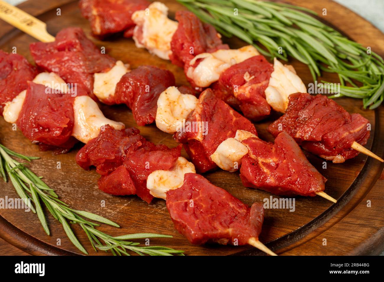 Beef cubed skewer. Raw shish kebab on gray background. Turkish cuisine
