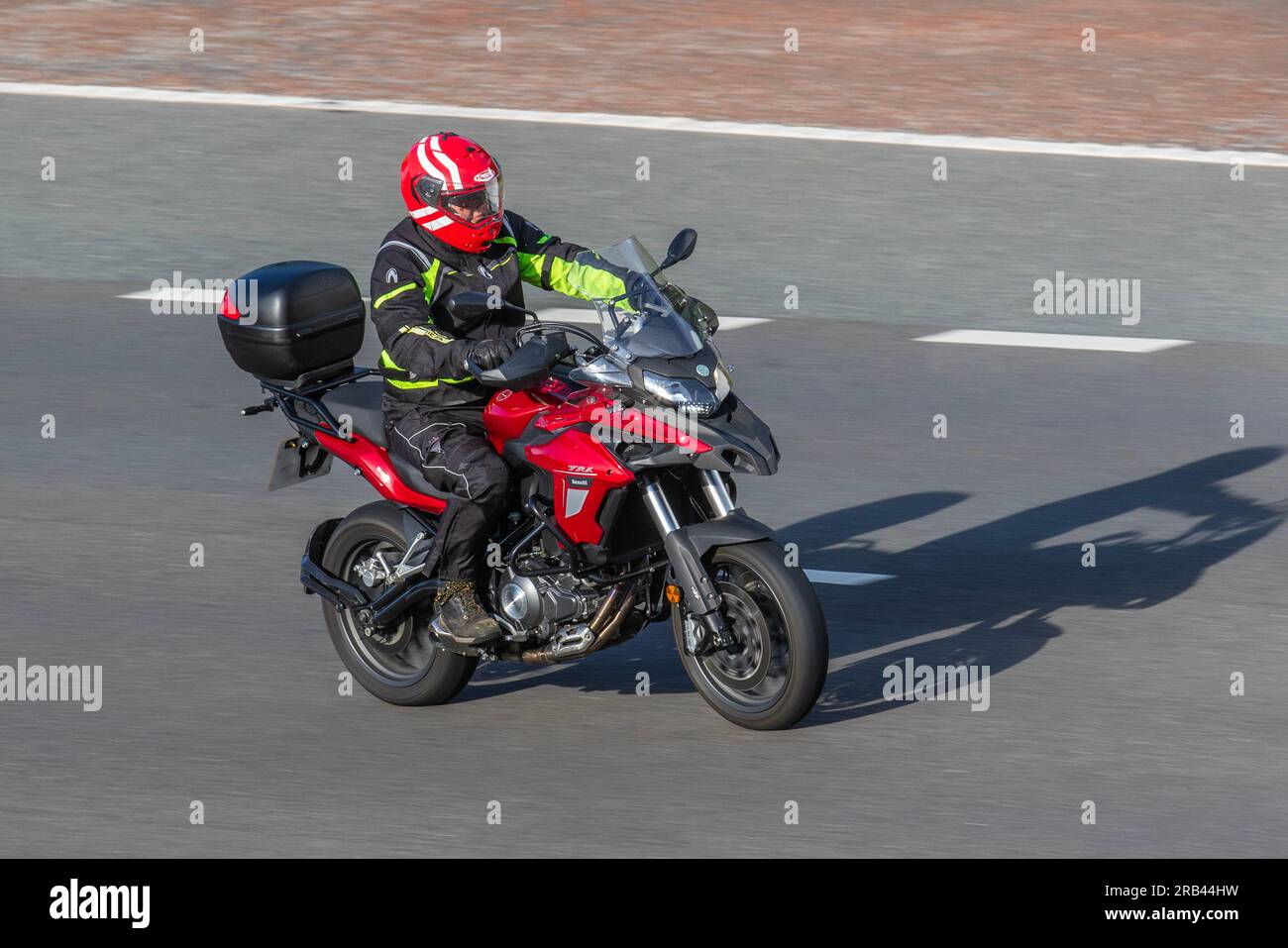 Benelli TRK 502 X motorcycle, rider with visor down, travelling at ...
