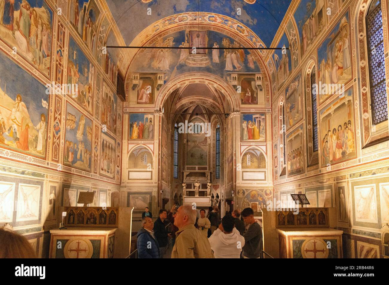 Padua Italy tourism; Visitors at Giottos frescoes, the Scrovegni Chapel interior, Padua Italy Stock Photo