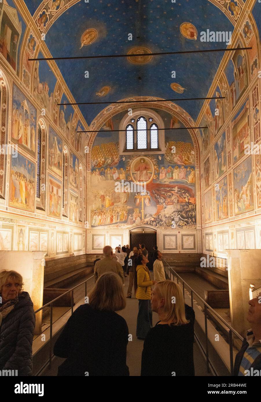 Tourists at Giottos frescoes, the Scrovegni Chapel interior, Padua Italy - 14th century Italian Renaissance paintings of  the Life of Christ; Stock Photo