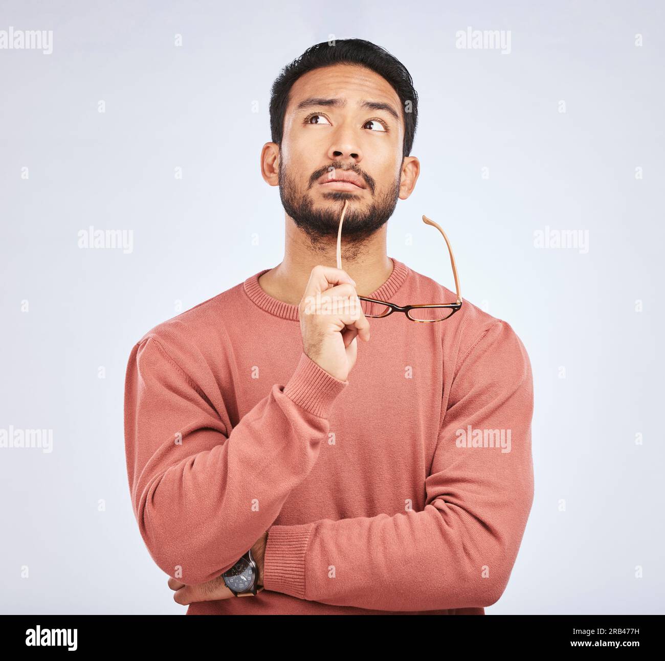 Decision, thinking and asian man in studio with glasses, questions and