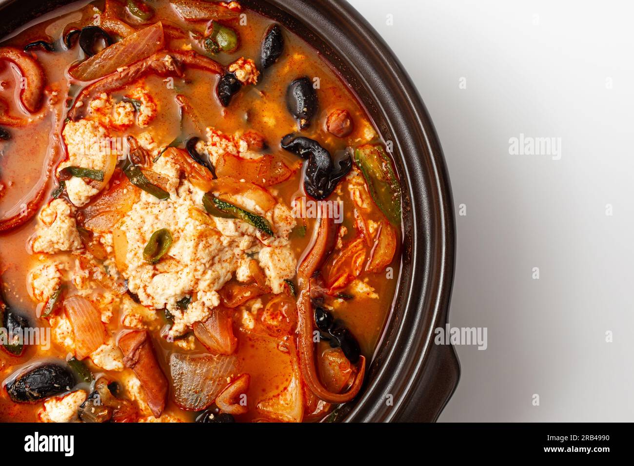 Soft tofu in jjamppong soup. Spicy soup with seafood and soft tofu