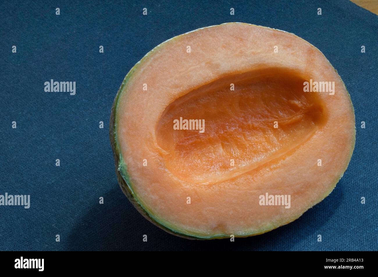 A closeup photo of a fresh and enticing cantaloupe melon, accentuated