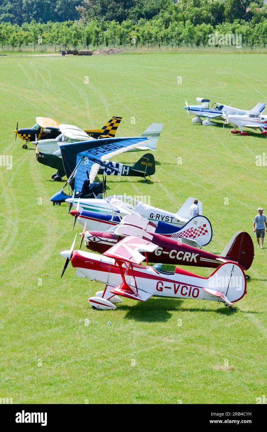 Planes on display at a wings and wheels flyin event in the countryside