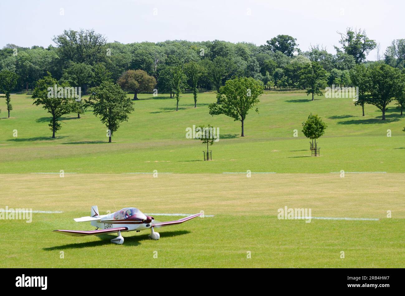 SAN Jodel DR-1050 Ambassadeur plane taxiing on grass airstrip at a wings and wheels event in the countryside at Heveningham Hall. Rural country Stock Photo