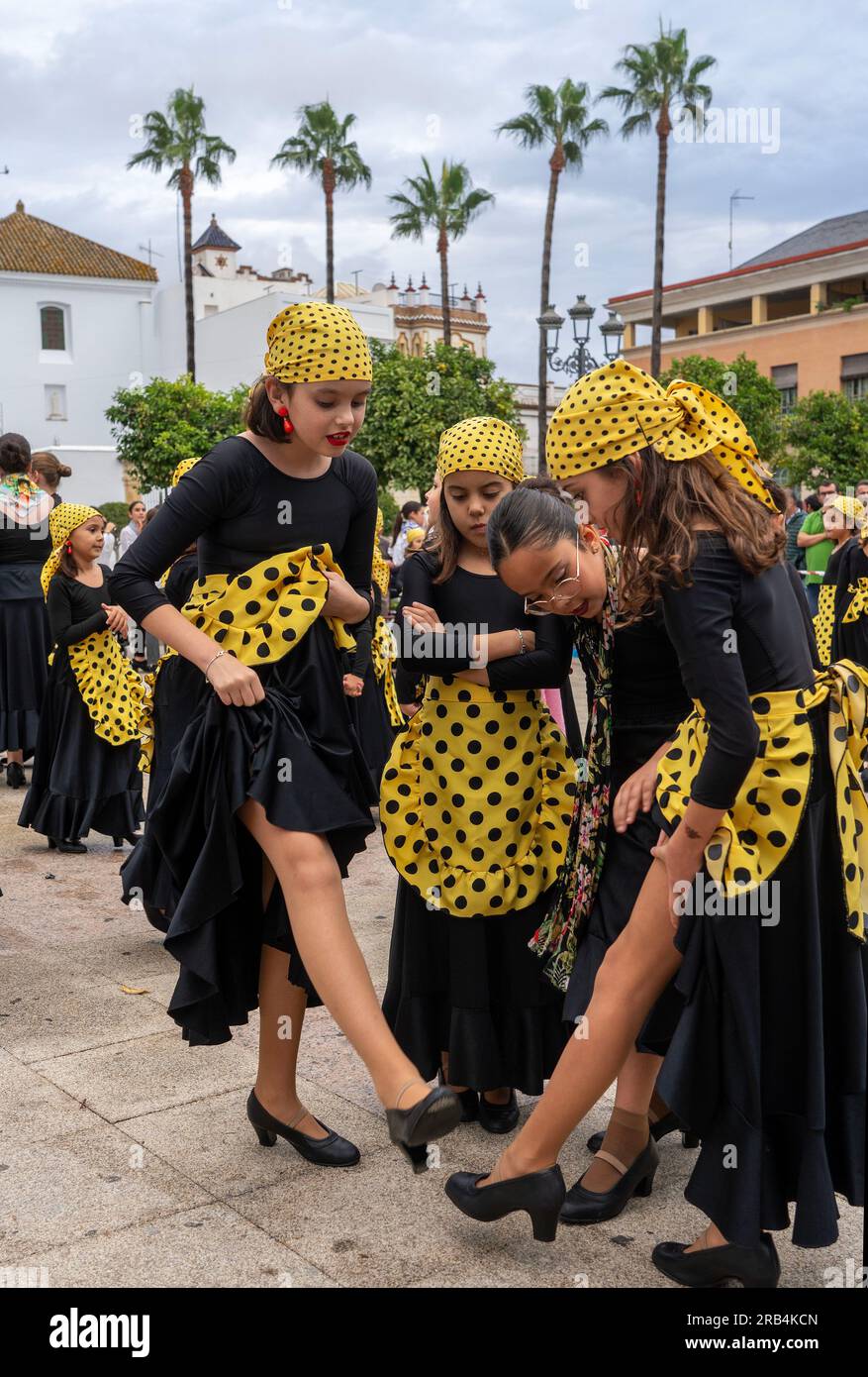 Flamenco flashmob performance in Lebrija town square Plaza de Espana,performed by schoolchildren on World Flamenco Day Stock Photo