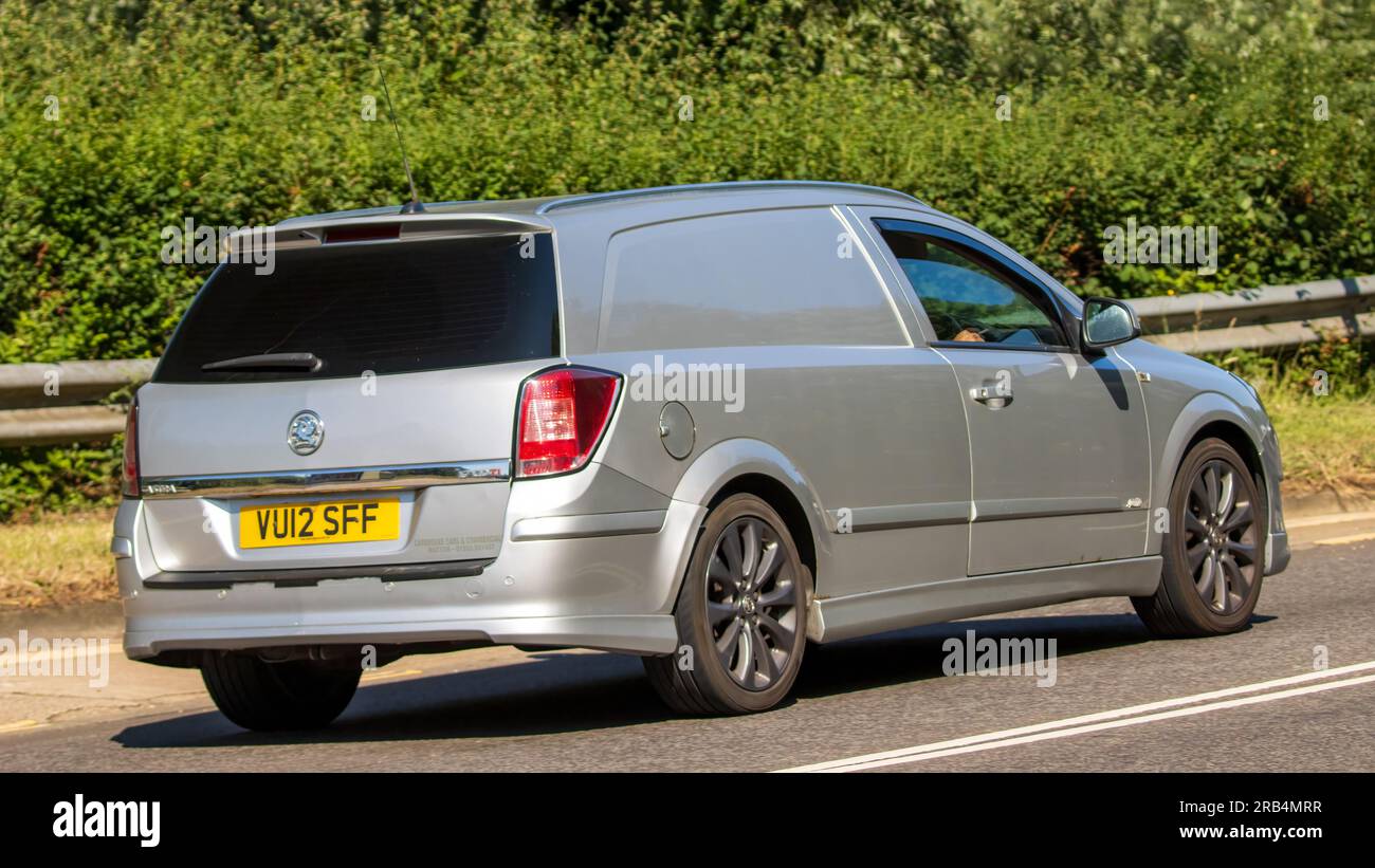 Milton Keynes,UK - July 7th 2023:  2012 silver diesel engine VAUXHALL ASTRA van travelling on a UK road Stock Photo