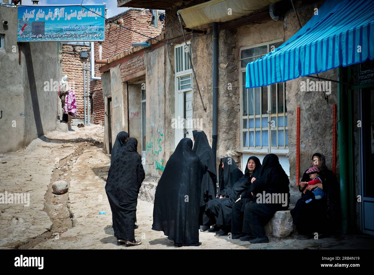 Iran. Azerbaijan region. Kandovan. women with chador Stock Photo