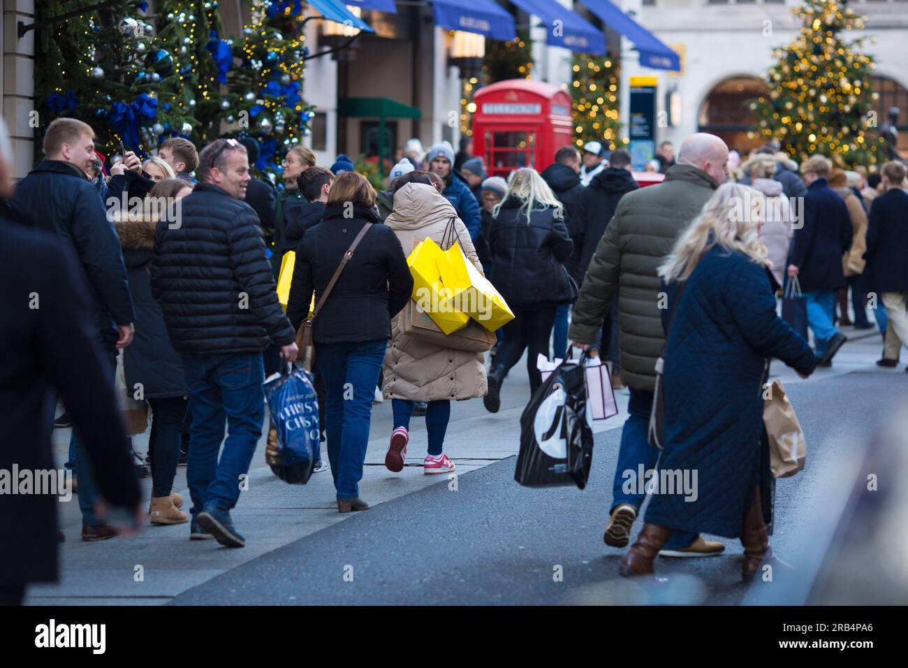 Shoppers walk in central London Stock Photo Alamy