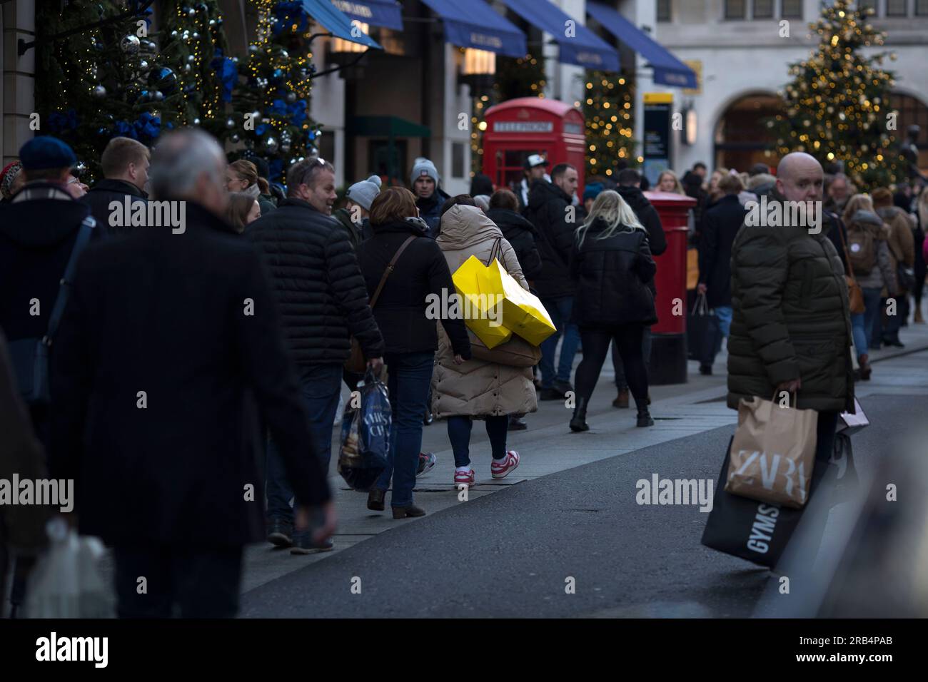 Shoppers walk in central London Stock Photo Alamy