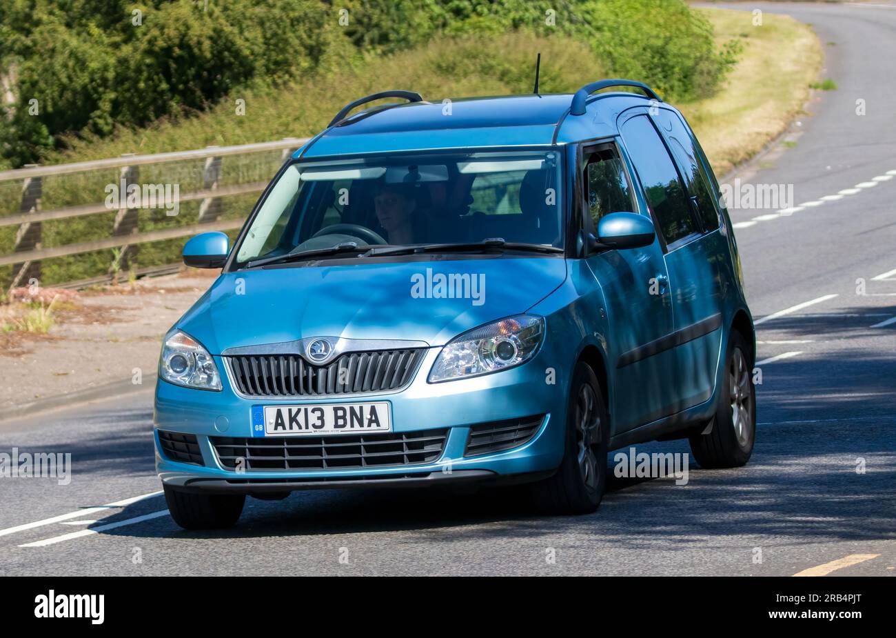 Milton Keynes,UK - July 7th 2023: 2013 blue SKODA ROOMSTER car travelling on a UK road Stock Photo