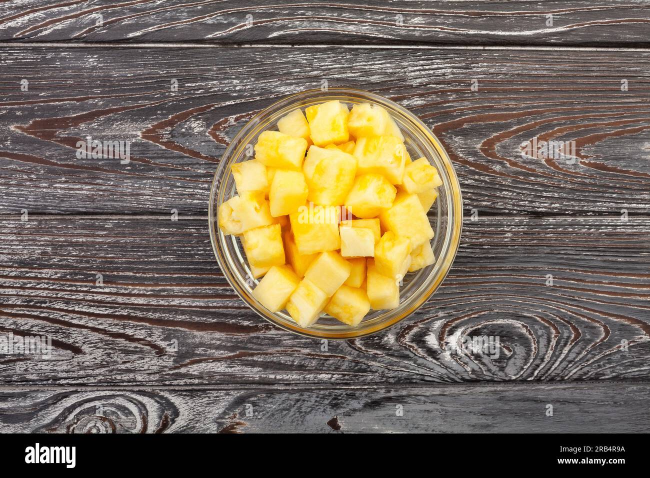 sliced pineapple on wood background Stock Photo